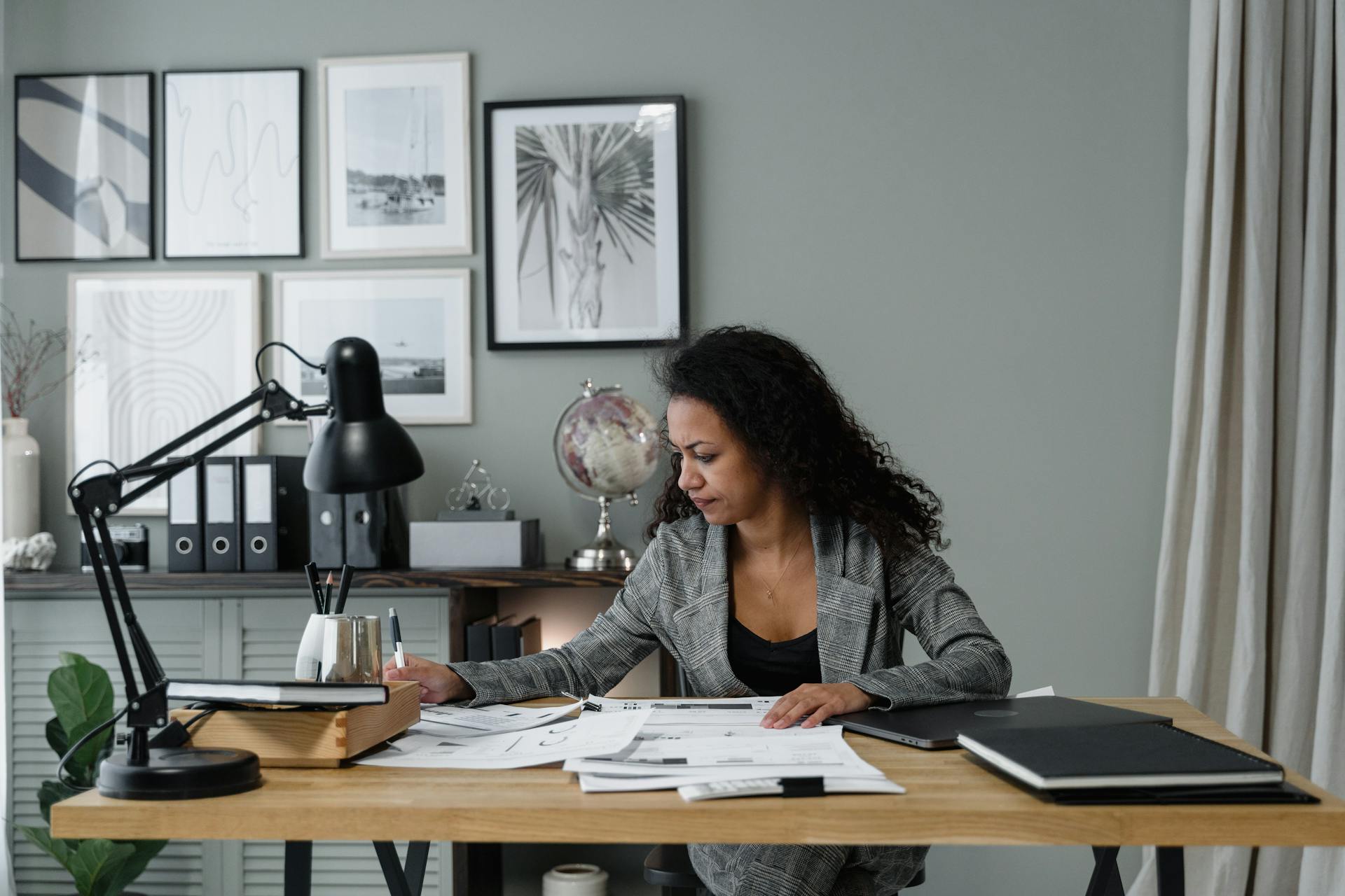 a person sitting at their desk reviewing paperwork